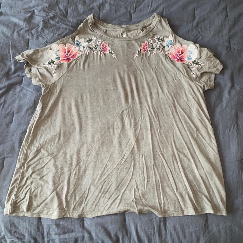 Green top with floral accents